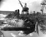 Wrecks of destroyers Downes and Cassin in Drydock One at Pearl Harbor Navy Yard, 7 Dec 1941, photo 5 of 5