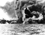 USS Arizona burning at Pearl Harbor, 7 Dec 1941, photo 1 of 5