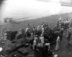 Sailors at Naval Air Station Ford Island reloading ammunition clips and belts between Japanese attack waves, Oahu, US Territory of Hawaii, 7 Dec 1941