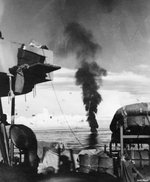 Downed Japanese special attack aircraft burning in the water, between Leyte and Mindoro in the Philippine Islands, 25-31 Dec 1944