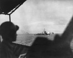 A Mahan-class destroyer, possibly Drayton or Lamson, bombarding the objective area during landings on the shores of Ormoc Bay, Leyte, Philippine Islands, 7 Dec 1944