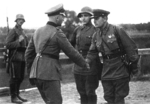 German and Soviet officers shaking hands, Poland, late Sep 1939