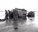 A Canadian gun-tractor skidded off the road on the flooded island of Beveland, the Netherlands, 28 Oct 1944