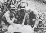 Officers of the Chinese 88th Division studying a map, Shanghai, China, Sep-Nov 1937; note Germany-supplied helmets