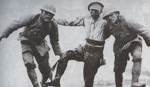 Two Japanese soldiers helping a wounded comrade off the battlefield near Suzhou Creek, Shanghai, China, late Oct 1937