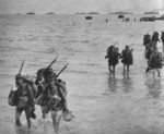 Japanese troops wading ashore from troop transports, Hangzhou Bay, Shanghai, China, Oct 1937