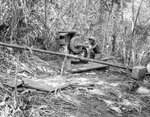 Man of 34th Construction Battalion working on water purification equipment, Solomon Islands, circa Aug 1945