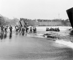 US Marines unloading supplies from LST-67 and another landing craft, Cape Gloucester, New Britain, Bismarck Archipelago, late Dec 1943