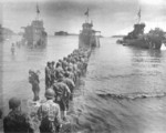 American troops unloading cargo from LCI vessels, Rendova, Solomon Islands, circa Jul 1943