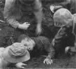 Japanese Army corporal Shigeto being dug out of his burrowed defensive position, Cape Gloucester, New Britain, Bismarck Archipelago, circa mid-Dec 1943