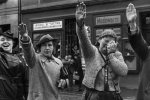 A Sudeten German woman cried in misery as she gave the Nazi Party salute while two others saluted with happiness, Sudetenland, Czechoslovakia, Oct 1938