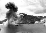 Japanese naval base, warships, and fishing boats at Dublon Island under American aerial attack, Truk Atoll, Caroline Islands, 16 Feb 1944, photo 2 of 2