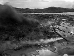 Aerial photo showing damage done to Japanese naval base at Dublon Island, Truk Atoll, Caroline Islands, 17-18 Feb 1944