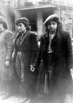 Jewish resistance fighters Rachela Wyszogrodzka or Rukhele Lauschvits (at left edge of photo), Bluma Wyszogrodzka, and Malka Zdrojewicz Horenstein in captivity in Warsaw, Poland, Apr-May 1943