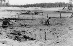 Finnish soldier dragging a box of ammunition on the eastern side of the Kollaa River, Russia, 17 Dec 1939