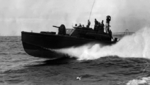 A US Navy PT Boat underway immediately off Midway Atoll, circa 1942
