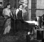 Men working with babbitt bearing, Pearl Harbor Navy Yard, US Territory of Hawaii, 1942