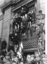 Hitler Youth members climbing window bars to observe May Day celebrations, Lustgarten, Berlin, Germany, 1 May 1935