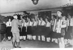 Youth from München, Germany singing for soldiers near front, Jan 1941