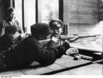 Hitler Youth members learning how to fire rifles, date unknown