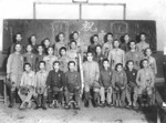 School children holding a farewell party for an ethnic Chinese school senior being drafted for Japanese military service, Taiwan, mid-1940s