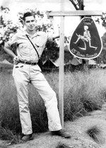 Jack Heyn posing next to a sign at the 13th Bomb Squadron of USAAF 3rd Bomb Group camp at Port Moresby, Australian Papua, early 1943