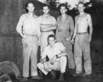 Roland Holmberg (rear far left), Robert Boucher (rear center left), Jack Heyn (rear center right), John Barr (rear far right), and Brackett (front) of USAAF 3rd Bomb Group photographic section, Dobodura Airfield, Australian Papua, mid-1943