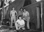 Seeley (rear left), John Paulovitch (rear center), Shemlynce (rear right), and Berube (front) of USAAF 3rd Bomb Group photographic section, Dobodura Airfield, Australian Papua, mid-1943