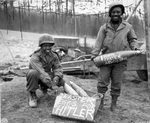 African American US Army soldiers T/5 William E. Thomas and Private First Class Joseph Jackson marking artillery shells as Easter presents for Adolf Hitler, 10 Mar 1945