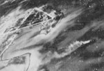 View of Toshien (now Zuoying) harbor and airfield, Takao (now Kaohsiung), Taiwan, 12 Oct 1944, photo 3 of 3; photo taken from aircraft of USS Wasp