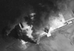 Seaplane hangars under US Navy carrier aircraft attack, Toko Bay (now Dapeng Bay), southern Taiwan, 12 Oct 1944, photo 4 of 7