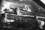 Carrier aircraft of Task Force 38 attacking the Japanese Army airfield at Takao (now Kaohsiung), Taiwan, 12 Oct 1944, photo 2 of 4; US intelligence referred to this field as 