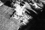 Carrier aircraft of Task Force 38 attacking the Japanese Army airfield at Takao (now Kaohsiung), Taiwan, 12 Oct 1944, photo 3 of 4; US intelligence referred to this field as 