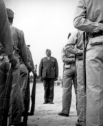 A platoon of African-American US Marine Corps recruits listening to drill instructor Sergeant Gilbert Hubert Johnson, Montford Point Camp, North Carolina, United States, Apr 1943