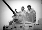 Two African-American United States Marine Corps recruits training with a light tank, Montford Point Camp, North Carolina, United States, Apr 1943