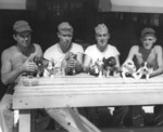 US Marines with puppies, Marshall Islands, 1940s