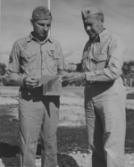 US Marine 3rd Amphibious Corps photographer William H. T. Swisher receiving Bronze Star medal from General Rockey, Guam, circa 1944