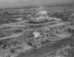 Kagi butanol plant under attack by B-25 bombers of 3rd Bombardment Group, USAAF 5th Air Force, Kagi (now Chiayi), Taiwan, 3 Apr 1945, photo 2 of 5