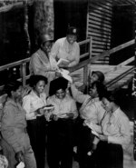 African-American US Army nurses receiving mail from home, 268th Station Hospital, Australia, 29 Nov 1943; 3 of the nurses were Lts. Prudence L. Burns, Inez Holmes, and Birdie E. Brown