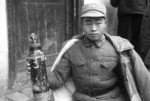 Chinese soldier holding an oxygen tank, 1930s-1940s