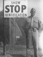 US Marine Frederick Strybing at the main gate of US military base Springtown Camp at Londonderry, Northern Ireland, United Kingdom, 1943