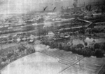 Kagi, Taiwan viewed from a US B-25 bomber during an attack, 3 Apr 1945; note palls of smoke at the rail marshalling yard