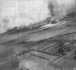 Kagi rail marshalling yard viewed by a B-25 bomber of USAAF 405th Bombardment Squadron during an attack, Taiwan, 3 Apr 1945, photo 2 of 2
