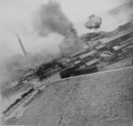 Nansei sugar plant under US air attack, Kagi (now Chiayi), Taiwan, 24 Apr 1945, photo 1 of 3