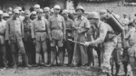 US soldier instructing flamethrower operations to Chinese soldiers, China, 1940s