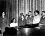 Contralto singer Marian Anderson entertaining a group of African-American US Army personnel, San Antonio Municipal Auditorium, San Antonio, Texas, United States, 11 Apr 1945