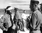 African-American pilot Lt. Andrew Marshall, shot down in Greece and kept in hiding by Greek resistant fighters, returned to tell his tale to an American pilot of the 51st Troop Carrier Wing, Oct 1944