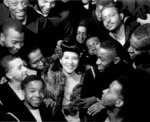 Singer Marva Louis, wife of boxing champion Joe Louis, posing with African-American US Navy sailors, US Naval Training Station, Great Lakes, Illinois, United States, date unknown