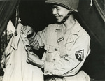 Japanese-American recruit of US 100th Infantry Battalion, an orderly for a general, preparing an uniform while training at Camp Shelby, Mississippi, United States, 1943