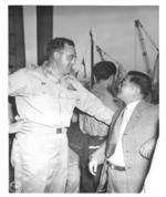 US Army Lieutenant Colonel A. A. Pursall of US 442nd Regimental Combat Team talking to former chaplain of the unit Japanese-American Masao Yamada, Honolulu, US Territory of Hawaii, 9 Aug 1946